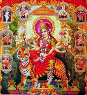 多臂印度教女神在寺廟中騎著老虎，周圍環繞著神聖人物。 — Maa Durga 壁紙