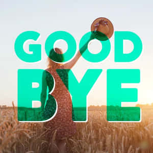 夕陽下麥田中舉起帽子並帶有 'GOODBYE' 文字疊加的女性。 — 再見 壁紙