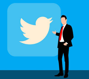 身穿西裝的商人對著藍色背景上的Twitter標誌做手勢。 — 推特 壁紙