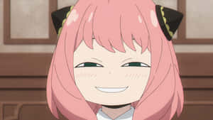 粉紅色頭髮和貓耳朵的動漫女孩在室內溫暖地微笑。 — 間諜家家酒 GIF 壁紙