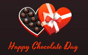 紅色心形巧克力盒，配有白色蝴蝶結和各式巧克力，並有「Happy Chocolate Day」文字。 — 16:10 壁紙