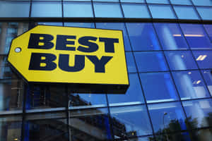 玻璃外牆建築上的Best Buy商店標誌及倒影。 — 最佳購買 壁紙