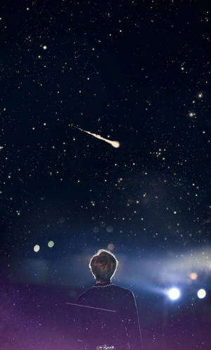 一個人在繁星點點的夜空中觀看流星。 — 銀河手機 壁紙