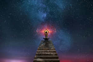 一個人在星空宇宙下的石階上冥想，身後有發光的星雲。 — 靈性美學 壁紙