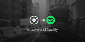 戴著耳機的人走開，Groove 標誌過渡到 Spotify 標誌。 — Spotify 壁紙