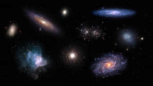 充滿活力的螺旋星系和發光的星雲漂浮在佈滿星辰的宇宙虛空中。 — 銀河 壁紙