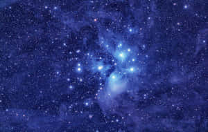 一個充滿活力的藍色星雲，被深空中無數星星環繞。 — 星星 壁紙