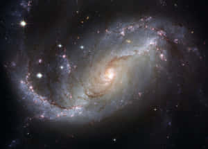 在深空中帶有發光旋臂和明亮星星的螺旋星系。 — 三星 壁紙