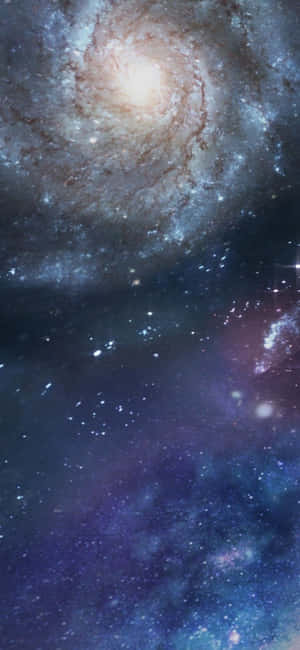 具有明亮核心和星狀臂的螺旋星系 — iPhone 11 Pro 壁紙
