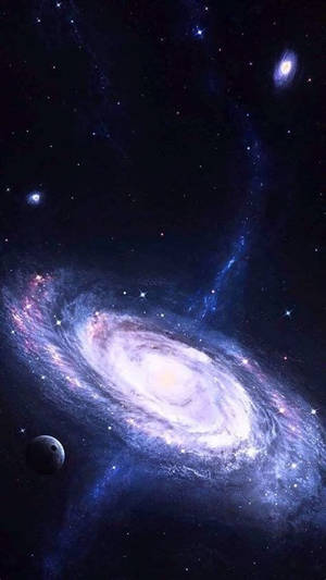 一個充滿活力的螺旋星系，在深空中擁有發光的星雲和遙遠的恆星。 — 銀河 壁紙