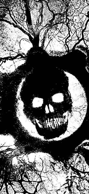 一個帶有發光眼睛的威脅性頭骨，被扭曲的樹枝包圍。 — iPhone 15 Plus 壁紙