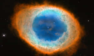 在深空中類似眼睛的充滿活力的藍色和橙色宇宙星雲。 — 星際效應 壁紙
