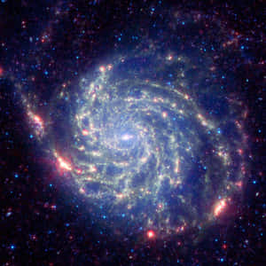 一個螺旋星系，在深空中旋轉著藍色和紅色的星團。 — 宇宙 壁紙