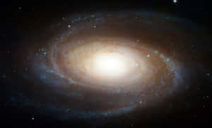 一個具有明亮核心和旋轉恆星臂的螺旋星系。 — 宇宙美學 壁紙