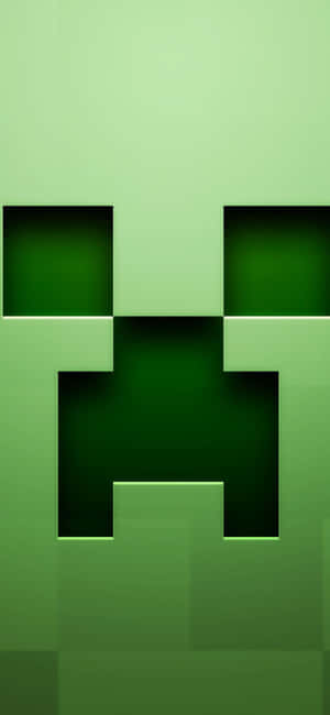 來自Minecraft的綠色像素化苦力怕臉孔，帶有發光的眼睛。 — Galaxy A54 壁紙