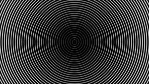 黑色背景上的白色同心圓，營造出催眠般的放射狀圖案。