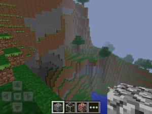 Minecraft遊戲視圖，顯示懸崖邊有樹木和河流。 — 我的世界 壁紙