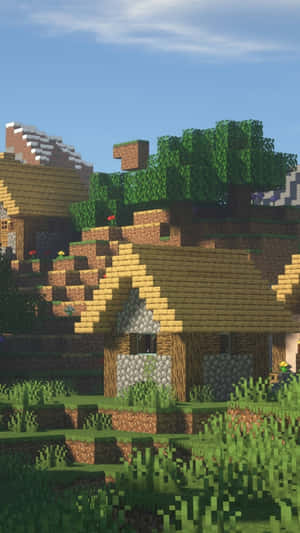 Minecraft村莊，有方塊狀房屋和樹木，在日光下。 — 我的世界 壁紙