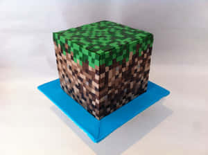 藍色底座上的像素化Minecraft草地磚蛋糕 — 蛋糕 壁紙