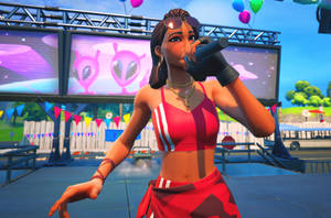 一個女性Fortnite角色在音樂會舞台上表演，身後有氣球和螢幕。 — 紅寶石 堡壘之夜 壁紙