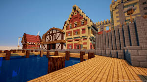 晴朗天空下，水邊有城堡和碼頭的Minecraft村莊 — 我的世界 壁紙
