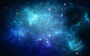 一個在深空中充滿恆星的發光藍色星雲。 — 星星 壁紙
