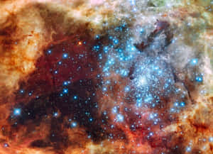 一個色彩繽紛的星雲，充滿發光的星星和旋轉的宇宙雲團。 — 星際效應 壁紙