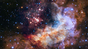 一個色彩繽紛的星雲，充滿了發光的氣體和深空中的星星。 — 宇宙 壁紙