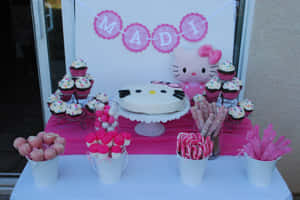 Hello Kitty主題生日甜點桌，配有粉紅色裝飾和糖果。 — Hello Kitty 萬聖節 壁紙