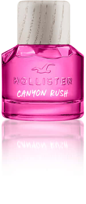 粉紅色Hollister Canyon Rush香水瓶，白色瓶蓋，置於反光表面。 — Galaxy Z Flip 壁紙