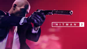 Hitman 2刺客在紅色燈光下瞄準消音手槍 — 超級英雄 壁紙
