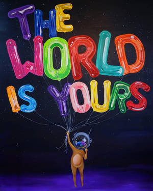 一個卡通太空人漂浮在太空中，拿著拼成「The World Is Yours」的氣球。 — 世界是你的 壁紙