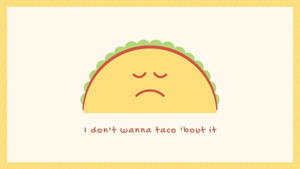 一個悲傷的卡通玉米捲，眼睛閉著，下方文字寫著「I don't wanna taco 'bout it」。 — 塔可 壁紙