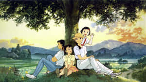 日落時分，家庭在風景如畫的山間草地上樹下放鬆。 — 櫻島麻衣 壁紙