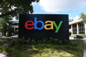 eBay企業標誌牌，位於辦公園區，周圍有綠化和車輛 — Off white 標誌 壁紙