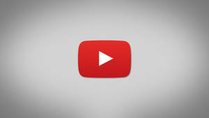 灰色背景上的 YouTube 播放按鈕標誌 — 簡約 壁紙