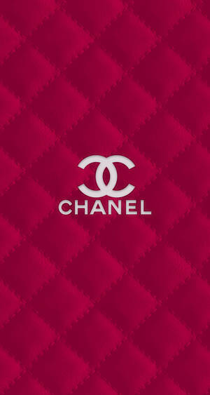 紅色菱格紋背景上的Chanel標誌 — 淺粉色調 壁紙