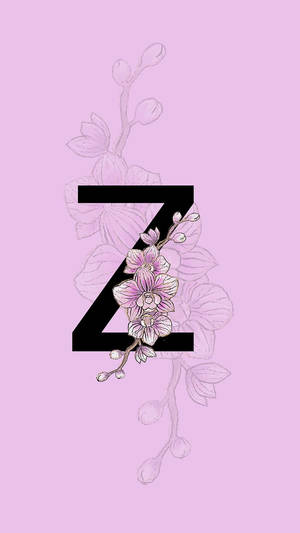 黑色字母Z在薰衣草背景上飾有粉紅色花朵。 — 字母 Z 壁紙