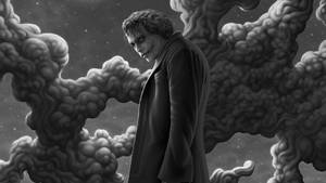 小丑穿著深色外套，在星空下被暴風雲環繞。 — 黑白小丑 壁紙