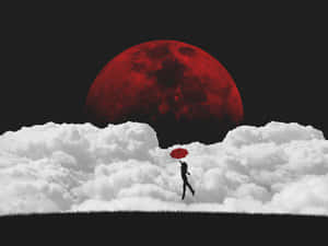 一個人在雲端行走的剪影，手持紅色雨傘，下方是紅色月亮。 — 高畫質月亮 壁紙