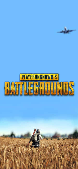 一個士兵在麥田裡，飛機飛過頭頂，帶有PUBG標誌。 — Infinix Hot 70 壁紙