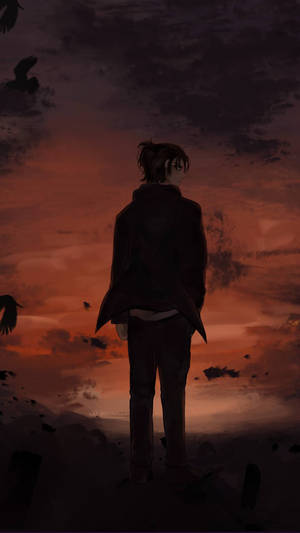 一個剪影中的人看著鳥兒在熾熱的日落天空飛翔。 — 艾連·葉卡 GIF 壁紙