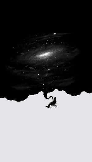 一個人在旋轉星系下的椅子上的剪影。 — 黑色高畫質桌布 壁紙