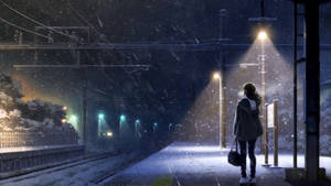 夜晚，街燈下積雪的火車月台上獨自等待的人。 — 寒冷 壁紙