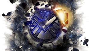 S.H.I.E.L.D.標誌以宇宙星辰和火焰穿破岩石。 — 洛米安傳奇 壁紙