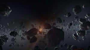 小行星在深空中穿過發光的星雲。 — 昏暗 壁紙
