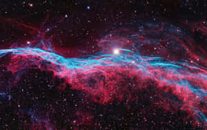 深空中帶有發光恆星的鮮豔紅藍宇宙星雲。 — 星際效應 壁紙