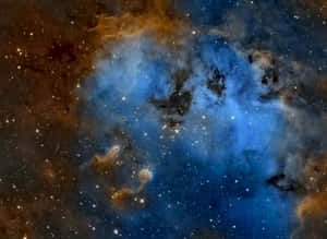 在深空中與星星一起發光的鮮豔藍色和橙色星雲。 — 星際效應 壁紙