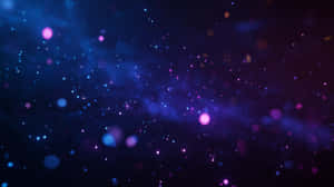 一個充滿活力的宇宙星雲，在深空中閃爍著藍色和紫色的星星。 — 抽象 壁紙