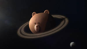 一個卡通熊形狀的行星，帶有光環，在太空中有一顆小衛星。 — LINE FRIENDS 壁紙